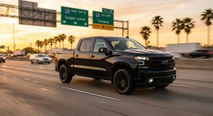 A Chevrolet Silverado 1500 truck driving at highway speeds along an open Texas road, illustrating the vehicle's speed limits and performance capabilities.